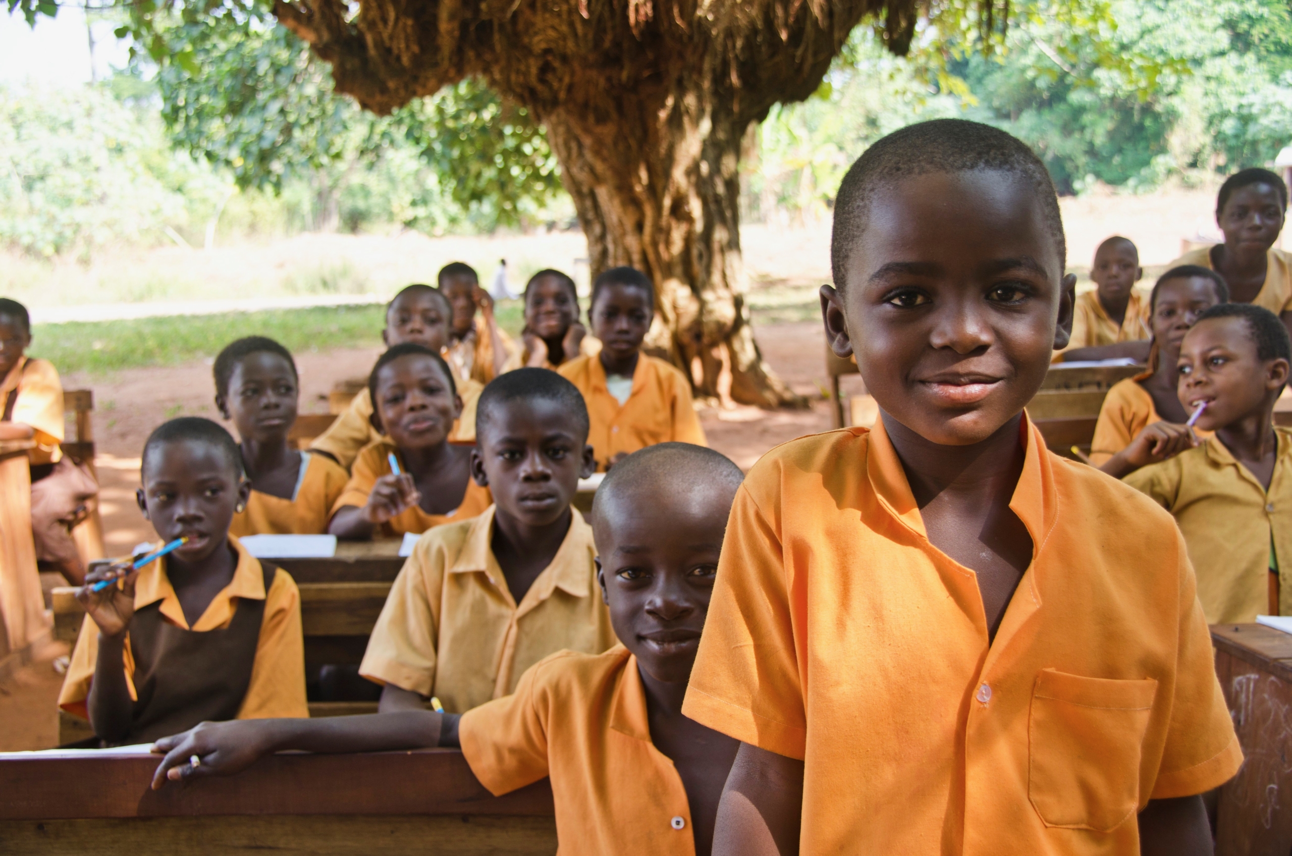 Children eating meals at a school in Ghana, part of the School Feeding Program.