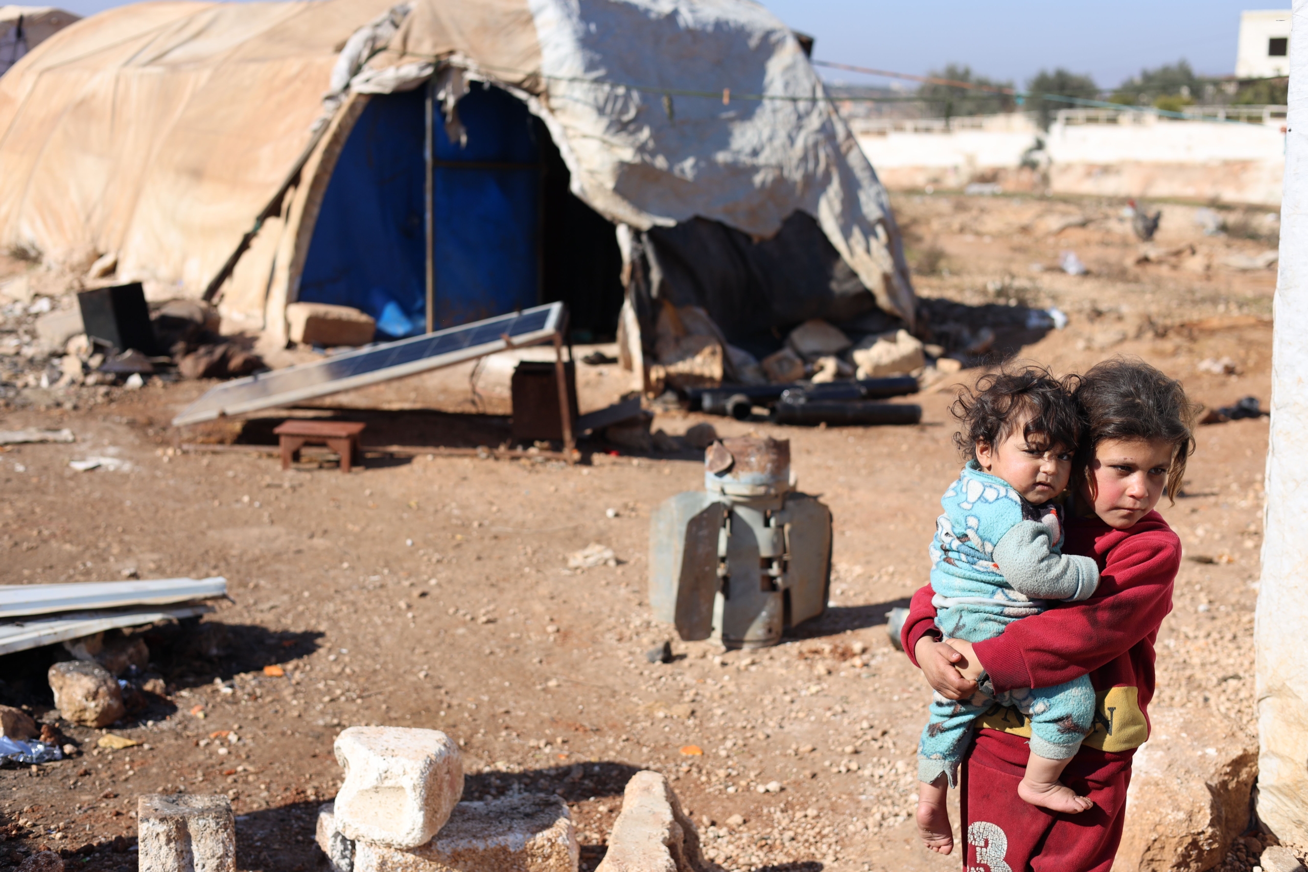Children in a Syrian refugee camp, highlighting NGO humanitarian initiatives. NGOs Working in Syria