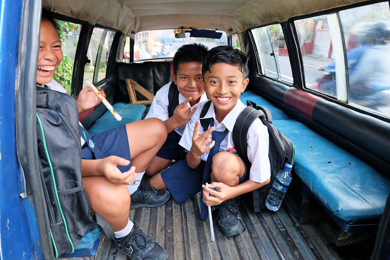 Children studying in a rustic Indonesian classroom, highlighting poverty in Indonesia's education system. Poverty and Education in Indonesia