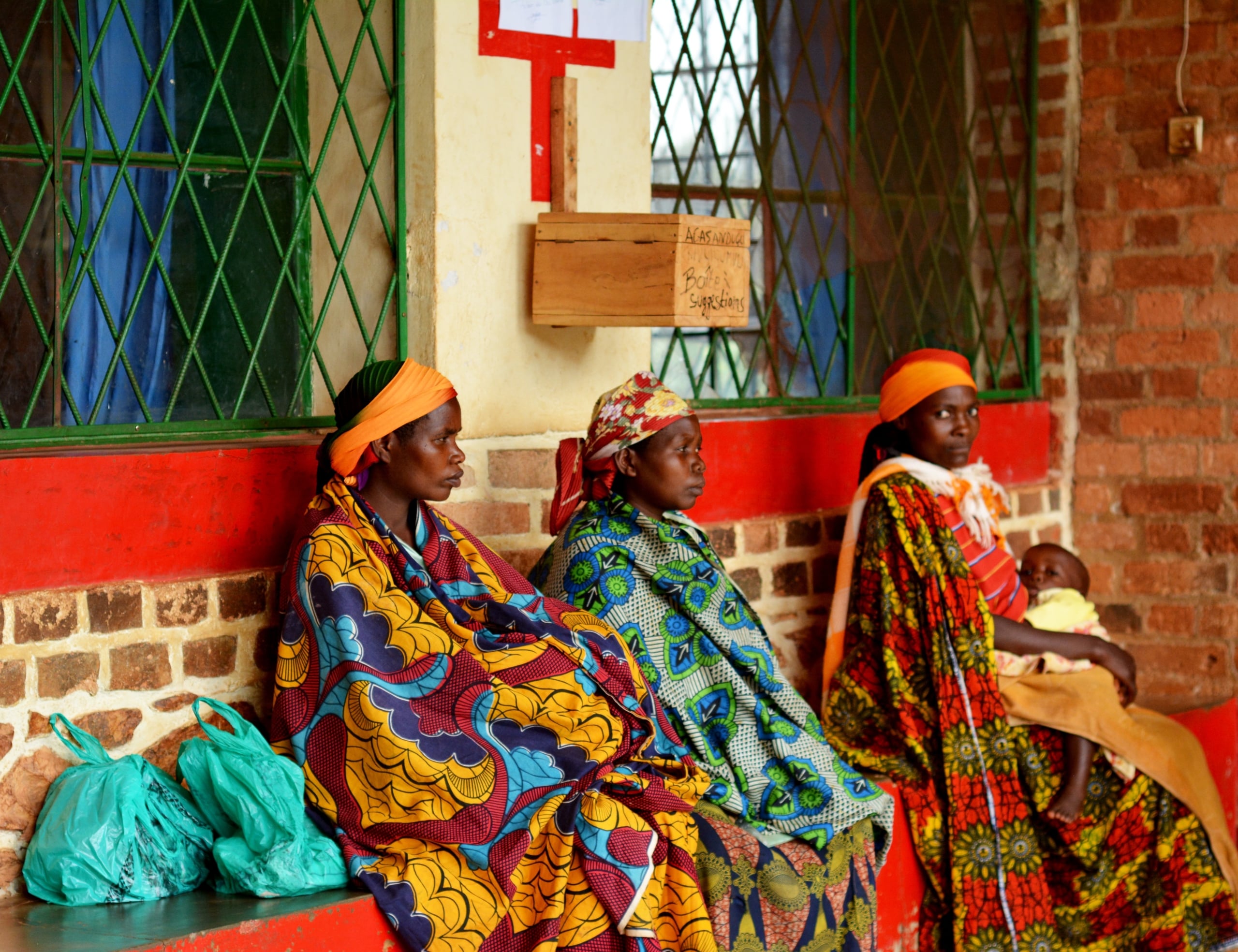 Two women in a hospital setting discussing healthcare, representing female empowerment in Sub-Saharan Africa. Female Empowerment in Sub-Saharan Africa