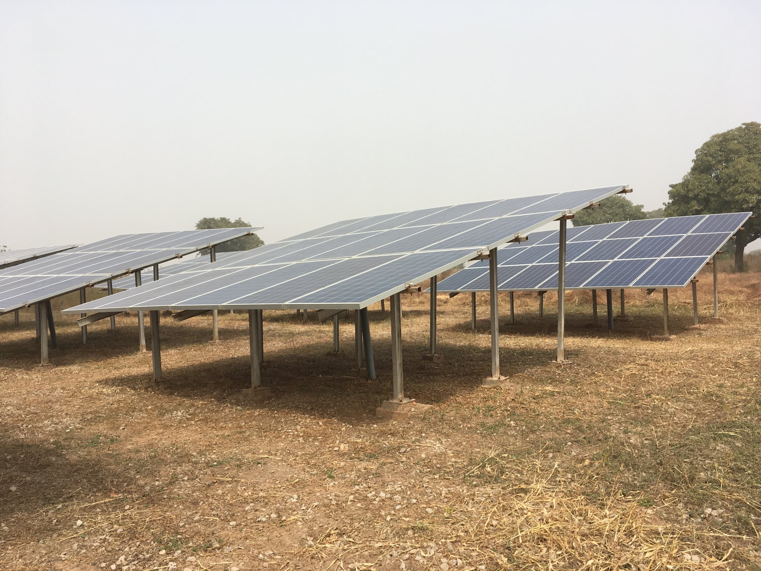 People gathered around a solar-powered mini grid installation in Oke-Oyi, Nigeria.